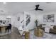 Open-concept living area with modern furnishings, a staircase, and an adjacent kitchen at 1961 N Hartford St # 1162, Chandler, AZ 85225