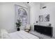 Bright main bedroom featuring vaulted ceiling, ample natural light, accent chair, and black sideboard at 1961 N Hartford St # 1162, Chandler, AZ 85225