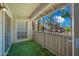 Enclosed balcony featuring views of community building and landscaping at 200 E Southern Ave # 222, Tempe, AZ 85282