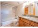 Bathroom featuring a shower and tub, wooden vanity, and granite countertop at 200 E Southern Ave # 222, Tempe, AZ 85282