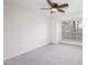 Bright bedroom with a ceiling fan and large window bringing in natural light at 200 E Southern Ave # 222, Tempe, AZ 85282