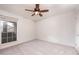 Bright bedroom featuring a ceiling fan and large window for natural light at 200 E Southern Ave # 222, Tempe, AZ 85282