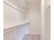 Walk-in closet offering storage solutions and wooden shelving at 200 E Southern Ave # 222, Tempe, AZ 85282