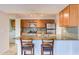 Kitchen with granite counters, stainless appliances, and views of laundry space at 200 E Southern Ave # 222, Tempe, AZ 85282