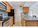Bright kitchen with stainless steel appliances, granite countertops, tile backsplash, and tile floors at 200 E Southern Ave # 222, Tempe, AZ 85282