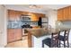 Well-lit kitchen featuring stainless steel appliances, granite countertops, and maple cabinets at 200 E Southern Ave # 222, Tempe, AZ 85282