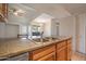 Open kitchen and dining area with granite counter tops and lots of room to entertain at 200 E Southern Ave # 222, Tempe, AZ 85282
