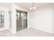 Light-filled living area with plush carpet, a sliding door to patio, and a modern chandelier at 200 E Southern Ave # 222, Tempe, AZ 85282