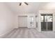 Spacious living room with plush carpeting, natural light, and a sliding glass door to the outside at 200 E Southern Ave # 222, Tempe, AZ 85282