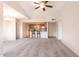 Open living area featuring neutral tones, breakfast bar, and updated lighting fixtures at 200 E Southern Ave # 222, Tempe, AZ 85282