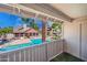 View of a large swimming pool with a grilling area and seating from a balcony at 200 E Southern Ave # 222, Tempe, AZ 85282