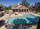 Aerial view of a community pool surrounded by lounge chairs and a grilling area at 200 E Southern Ave # 222, Tempe, AZ 85282