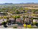 Panoramic aerial view highlights community homes with desert landscaping and a sparkling blue swimming pool at 22406 N 36Th Way, Phoenix, AZ 85050