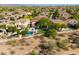 Gorgeous aerial shot showcases a single Gathering home's sparkling pool and desert landscaping within a lovely community at 22406 N 36Th Way, Phoenix, AZ 85050
