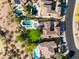 Birds-eye view of home features a backyard swimming pool, lounge area, and lush tree in established neighborhood at 22406 N 36Th Way, Phoenix, AZ 85050