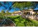 Expansive backyard features lush green lawn and an outdoor dining area for relaxing or entertaining at 22406 N 36Th Way, Phoenix, AZ 85050