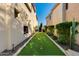 A private putting green between the homes creates a unique outdoor recreation area at 22406 N 36Th Way, Phoenix, AZ 85050