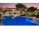 Stunning backyard features a sparkling pool, fire pit, and outdoor seating, perfect for entertaining at 22406 N 36Th Way, Phoenix, AZ 85050