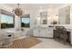 Luxurious bathroom with a freestanding tub, double vanity, and elegant chandelier at 22406 N 36Th Way, Phoenix, AZ 85050