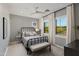 Cozy bedroom features a stylish black bed frame and bright, shuttered windows at 22406 N 36Th Way, Phoenix, AZ 85050