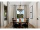 Inviting dining room featuring a round table, elegant chandelier, and natural light from the window at 22406 N 36Th Way, Phoenix, AZ 85050