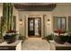Welcoming entryway with stone columns, decorative planters, and a view into the open floor plan at 22406 N 36Th Way, Phoenix, AZ 85050