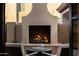 The covered outdoor fireplace is perfect for entertaining and sitting by a warm fire at 22406 N 36Th Way, Phoenix, AZ 85050