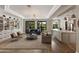 An expansive living room with open floor plan has views of the backyard at 22406 N 36Th Way, Phoenix, AZ 85050