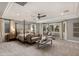 Spacious main bedroom with a canopy bed, sitting area, and natural light from the windows at 22406 N 36Th Way, Phoenix, AZ 85050