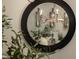 Custom light fixtures and a view of the dining room are seen in this stunning mirror at 22406 N 36Th Way, Phoenix, AZ 85050