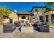 Relaxing outdoor patio with a fire pit, comfortable seating, and an outdoor television at 22406 N 36Th Way, Phoenix, AZ 85050