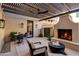 This covered outdoor patio features a fireplace, dining area, and seating area at 22406 N 36Th Way, Phoenix, AZ 85050