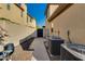 Private side yard featuring a walkway and mature landscaping with a gate and AC Units at 22406 N 36Th Way, Phoenix, AZ 85050