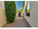 Low-maintenance side yard with gravel and gated access to back at 22406 N 36Th Way, Phoenix, AZ 85050