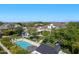 Aerial view of a property with a pool, trampoline and patio area, surrounded by mature landscaping at 23902 S 202Nd Ct, Queen Creek, AZ 85142