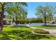 Lush backyard featuring a sparkling pool, outdoor kitchen, and manicured landscaping at 23902 S 202Nd Ct, Queen Creek, AZ 85142