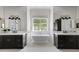Beautiful bathroom featuring double sinks, a soaking tub, and a large window at 23902 S 202Nd Ct, Queen Creek, AZ 85142