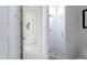 Bright bathroom showcasing the shower area with white tiles, glass partition, and modern fixtures at 23902 S 202Nd Ct, Queen Creek, AZ 85142