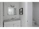 Bright bathroom featuring a vanity with a gray countertop and white subway tile at 23902 S 202Nd Ct, Queen Creek, AZ 85142