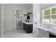Luxury bathroom with a soaking tub, walk-in shower, and double sink vanity at 23902 S 202Nd Ct, Queen Creek, AZ 85142