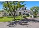 Attractive two-story home featuring a well-maintained lawn, mature trees, and a charming mailbox near the street at 23902 S 202Nd Ct, Queen Creek, AZ 85142