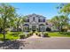 Elegant exterior showcasing manicured landscaping and mature trees, exuding curb appeal at 23902 S 202Nd Ct, Queen Creek, AZ 85142