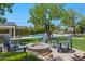 Charming fire pit area with comfortable seating and lush landscaping for outdoor enjoyment at 23902 S 202Nd Ct, Queen Creek, AZ 85142