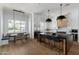 Modern kitchen with an island, stainless steel appliances, and a breakfast nook at 23902 S 202Nd Ct, Queen Creek, AZ 85142