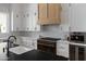 Gourmet kitchen with custom cabinets, professional-grade appliances, and sleek countertops at 23902 S 202Nd Ct, Queen Creek, AZ 85142