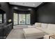 Modern living room with a large white sectional, custom built ins and plenty of natural light at 23902 S 202Nd Ct, Queen Creek, AZ 85142