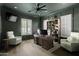 Stylish office featuring paneled walls, custom shelving, and hardwood floors at 23902 S 202Nd Ct, Queen Creek, AZ 85142