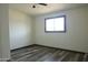 Cozy bedroom featuring wood-look floors, neutral walls, and a ceiling fan at 2902 W Bloomfield Rd, Phoenix, AZ 85029