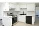 Updated kitchen with white cabinetry, stainless steel appliances and light countertops at 2902 W Bloomfield Rd, Phoenix, AZ 85029