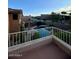 Balcony view overlooking a backyard with a sparkling pool, lounge area, and lush greenery at 31203 N 43Rd St, Cave Creek, AZ 85331